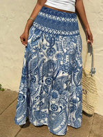 Person wearing a blue and white patterned skirt with a beige background
