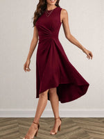 Woman wearing a burgundy dress with a white background