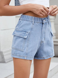 Denim shorts worn by a person with a blurred background