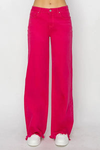 Bright pink jeans on a white background