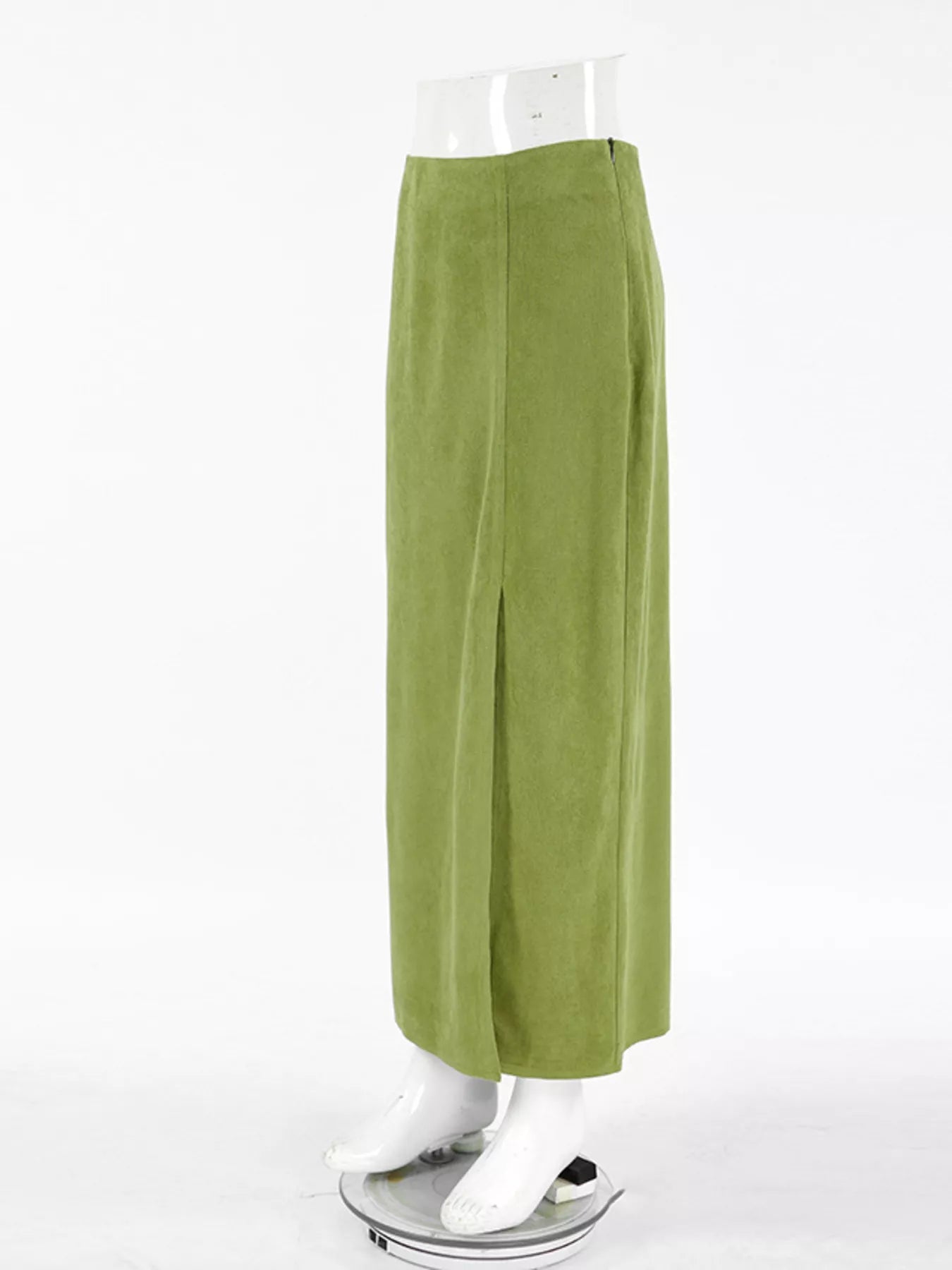Green pants on a mannequin against a white background