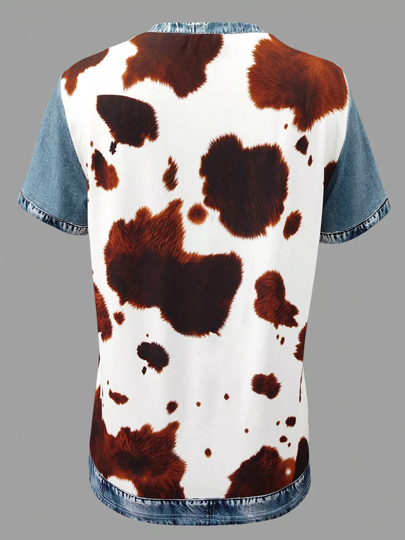 T-shirt with cow print design on a gray background