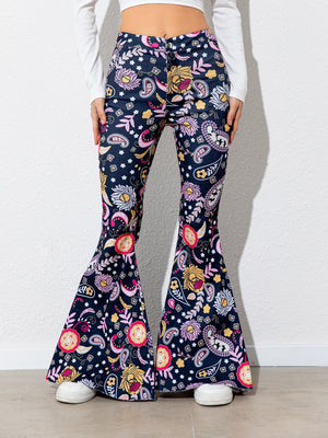 Flared pants with colorful pattern worn by a person on a white background