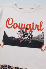 Light-colored sweatshirt with 'Cowgirl' graphic design featuring a rider on a horse.