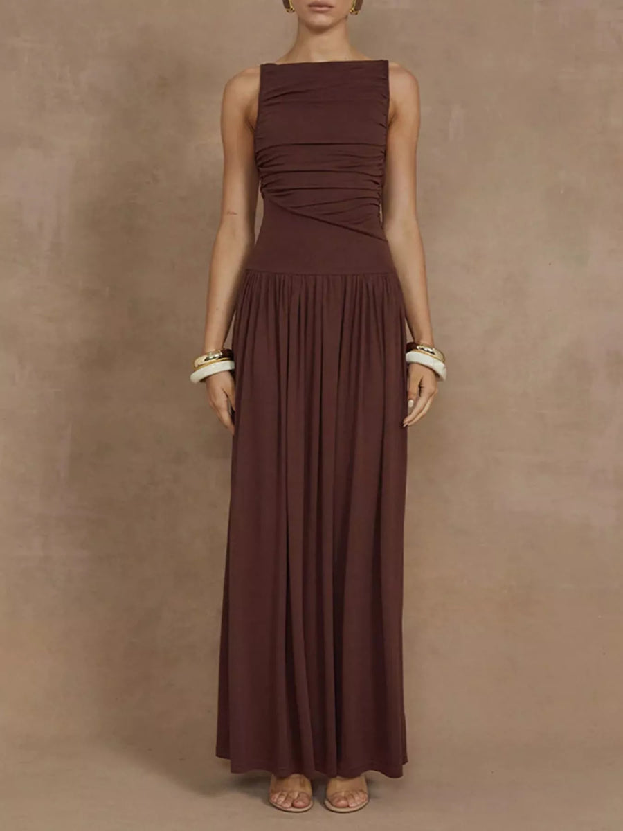 Woman wearing a brown dress against a beige background