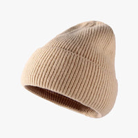 Beige knit beanie on a white background