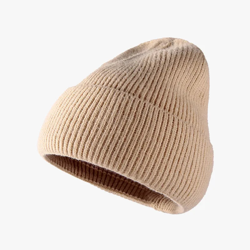 Beige knit beanie on a white background