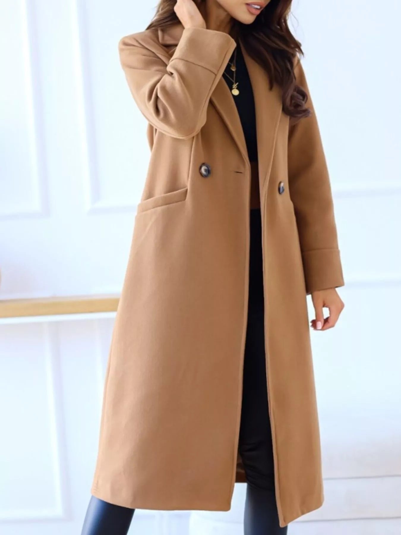 Brown coat worn by a person on a white background