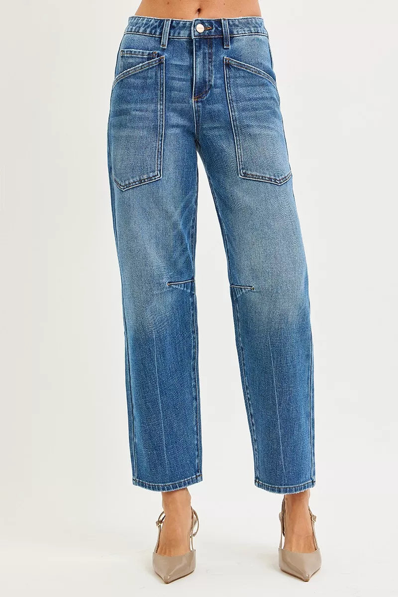 Blue jeans worn by a person on a white background