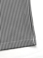 Close-up of black and white striped fabric on a white background