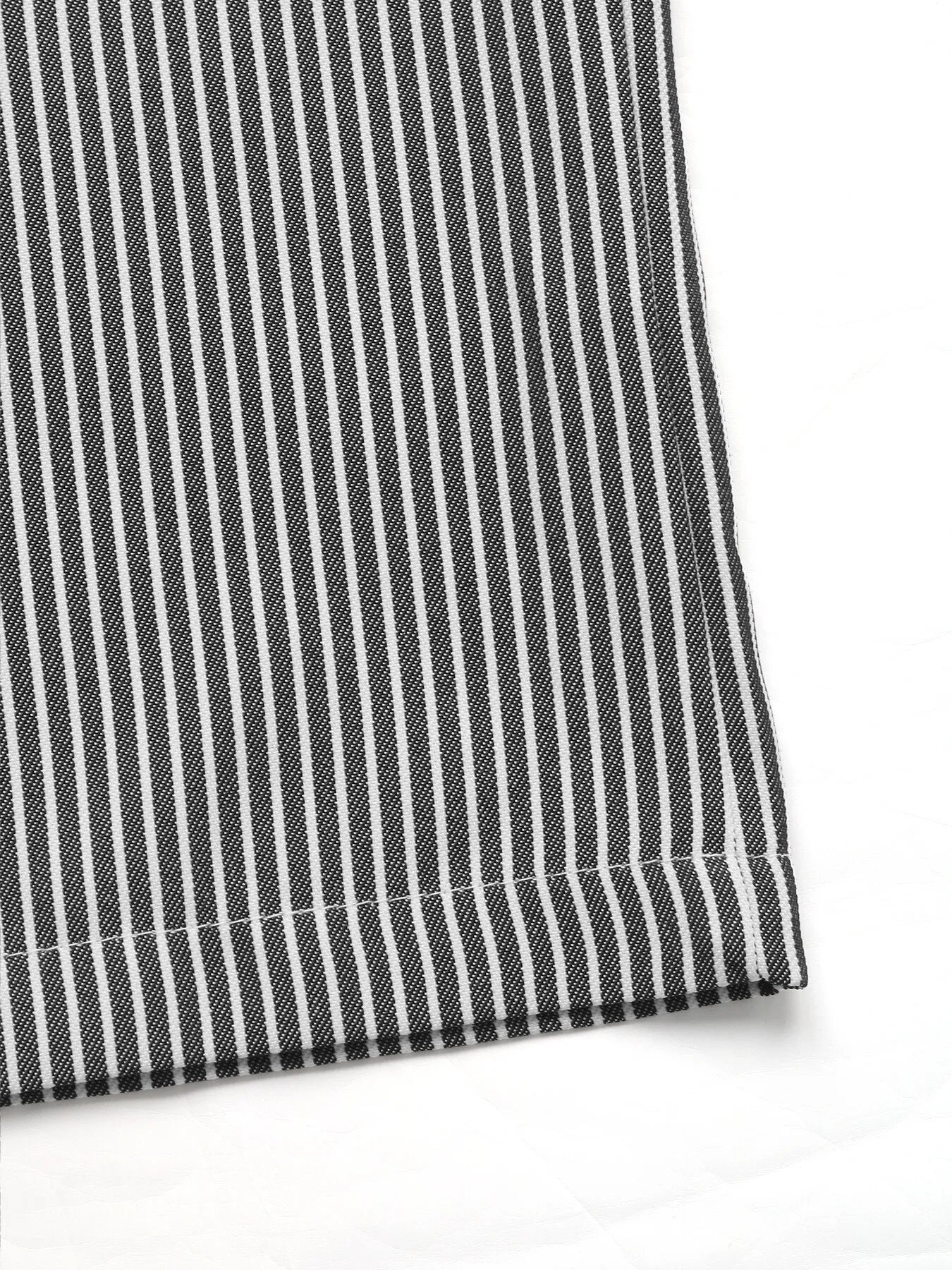 Close-up of black and white striped fabric on a white background
