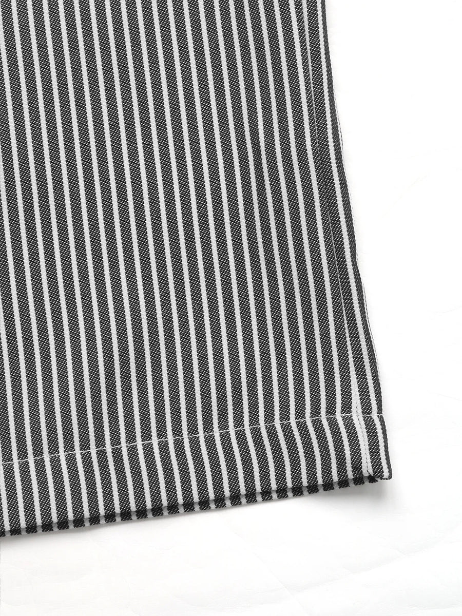 Close-up of black and white striped fabric on a white background
