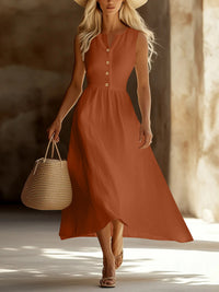 Woman in a rust-colored dress holding a straw bag in a warm-toned setting