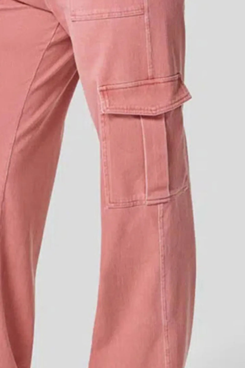 Close-up of pink cargo pants on a light gray background