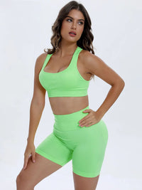 Woman wearing a bright green athletic outfit on a white background