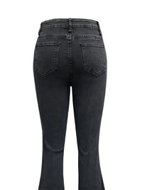 Black jeans shown from the back on a white background