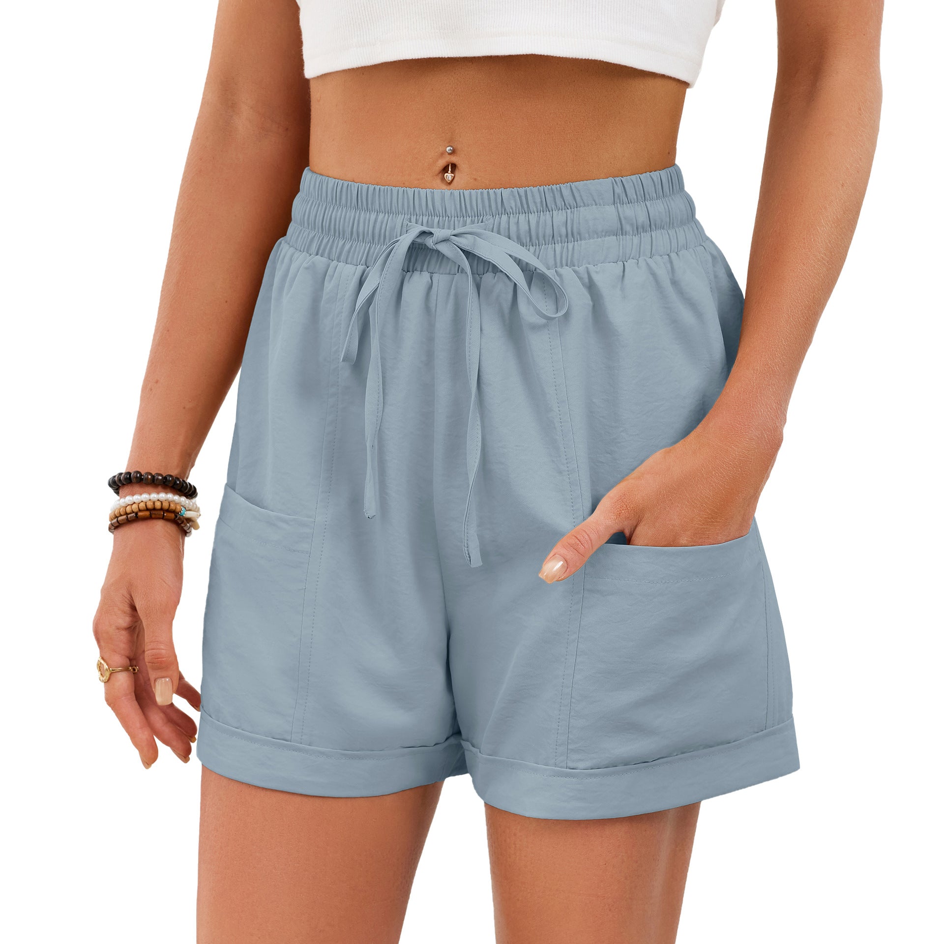 Light blue shorts worn by a person on a white background