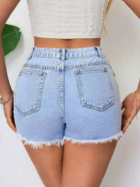 Light blue denim shorts worn by a person on a white background