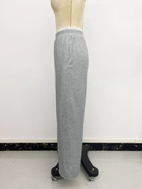 Gray sweatpants on a mannequin against a white background