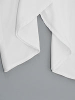 White fabric folded on a gray background