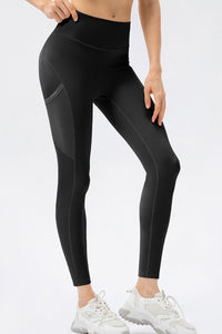 Black leggings worn by a person on a white background