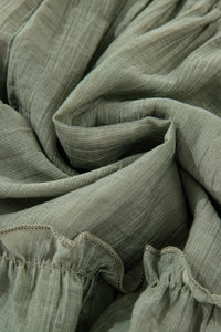 Close-up of green fabric with ruffled edges