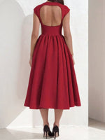 Red dress with open back on a white background
