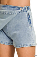 Light blue denim shorts on a white background