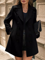 Woman wearing a black coat with a blurred background
