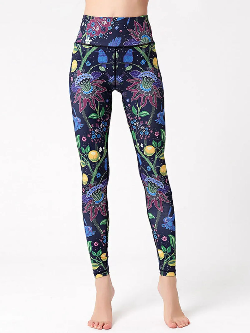 Colorful floral and insect patterned leggings on a white background