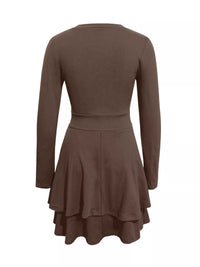 Brown dress with long sleeves and a flared skirt on a white background