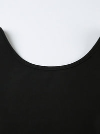 Close-up of a black garment with a white background