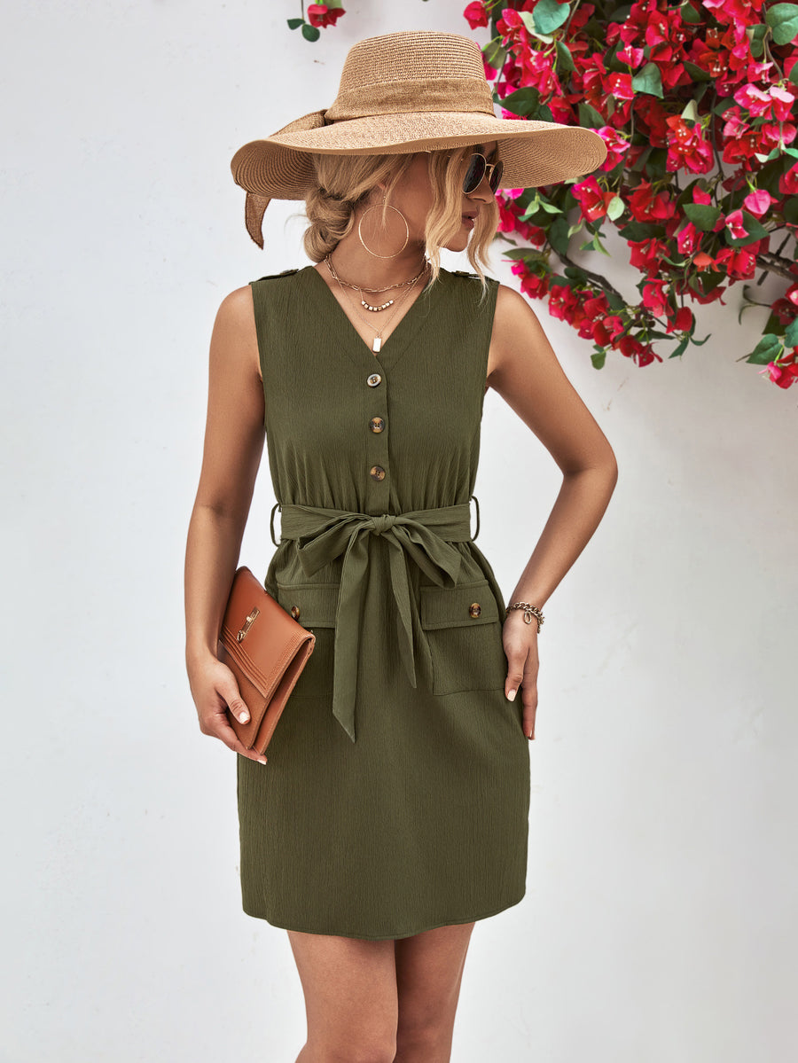 Woman wearing a green dress and beige hat with a red floral background