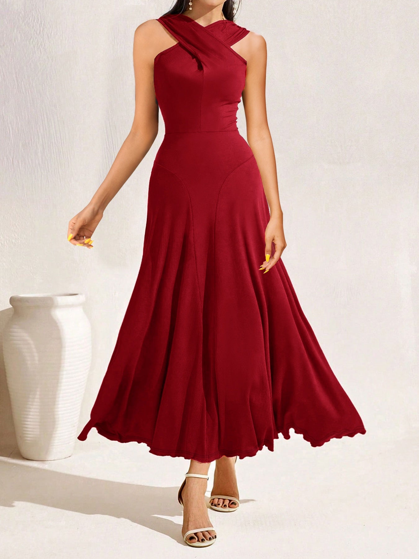 Red dress worn by a model on a white background