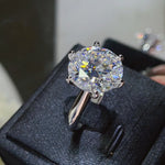 Diamond ring on a black jewelry box with a blurred background