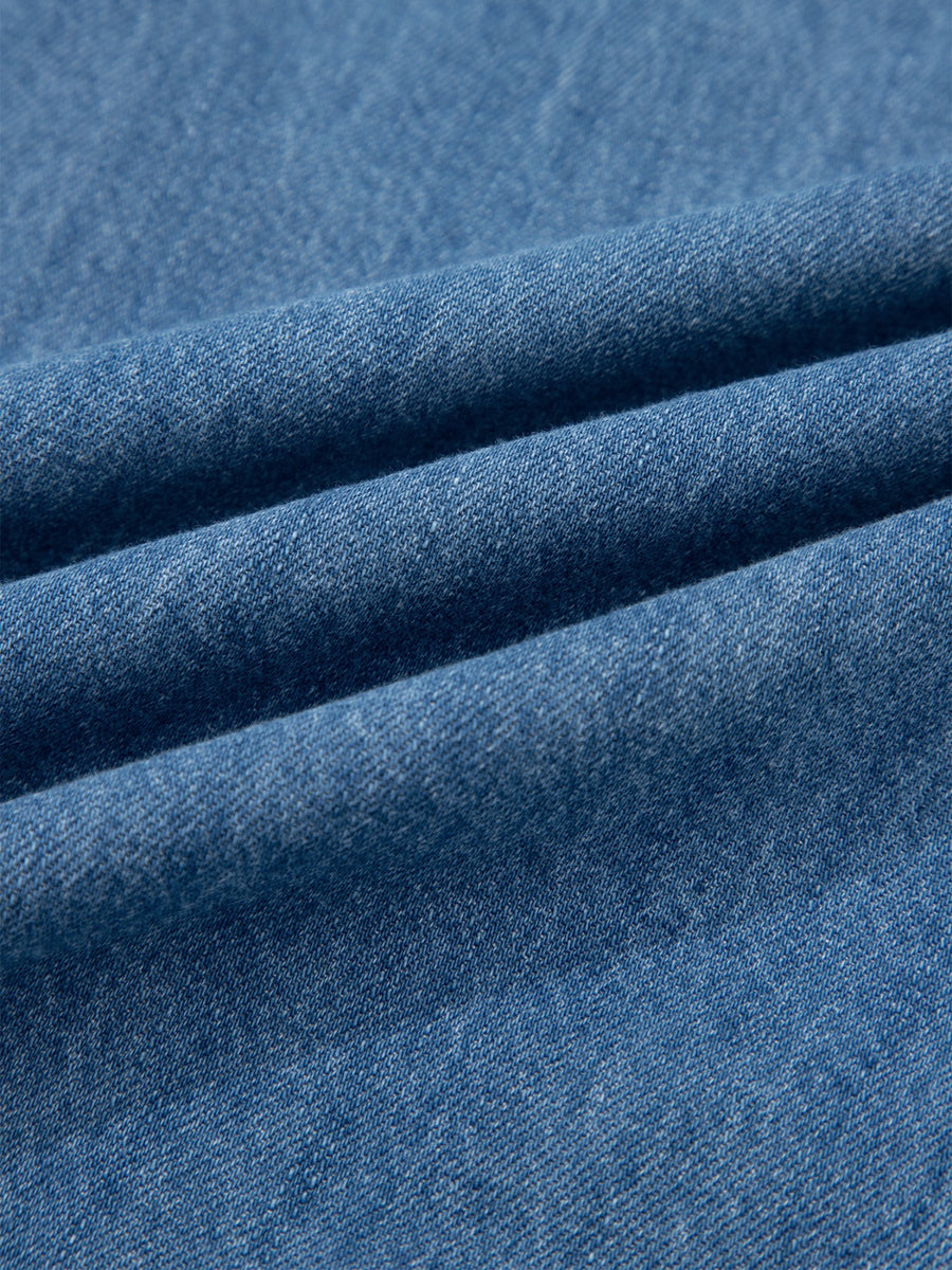 Close-up of blue denim fabric with visible texture