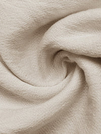 Close-up of beige fabric with a soft texture