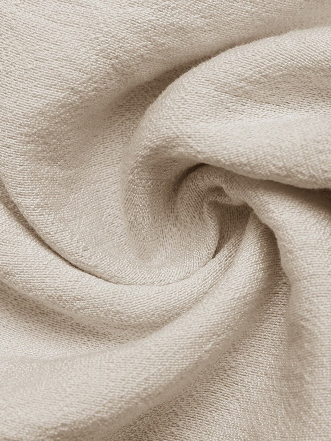 Close-up of beige fabric with a soft texture