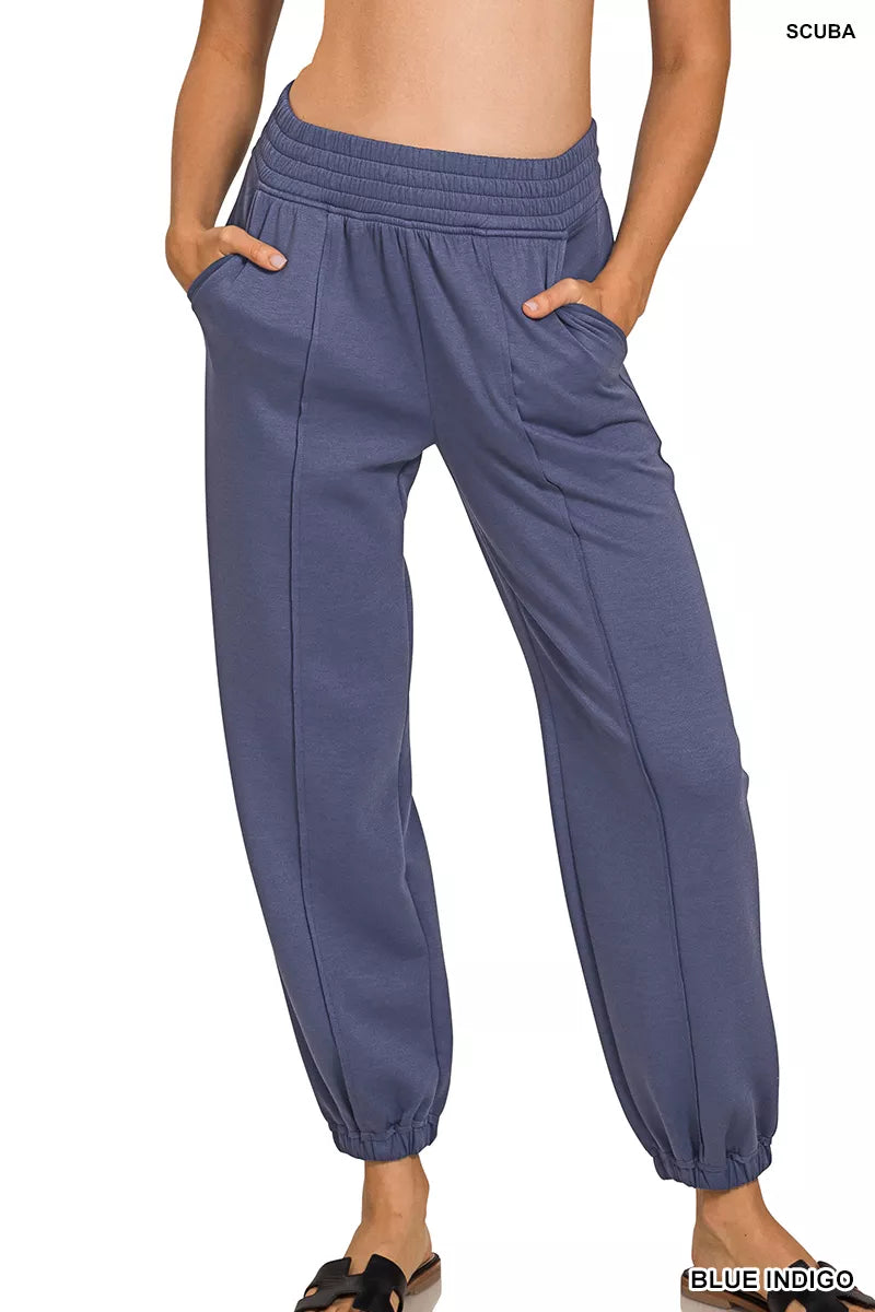 Blue pants worn by a person on a white background