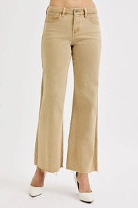 Beige jeans worn by a person on a white background