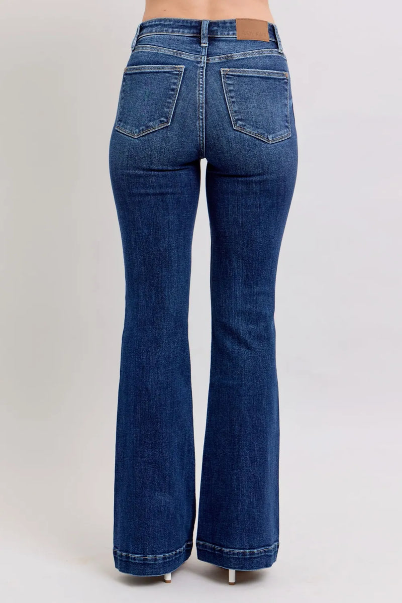 Blue flared jeans on a white background