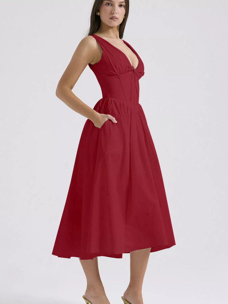 Red dress worn by a model on a white background