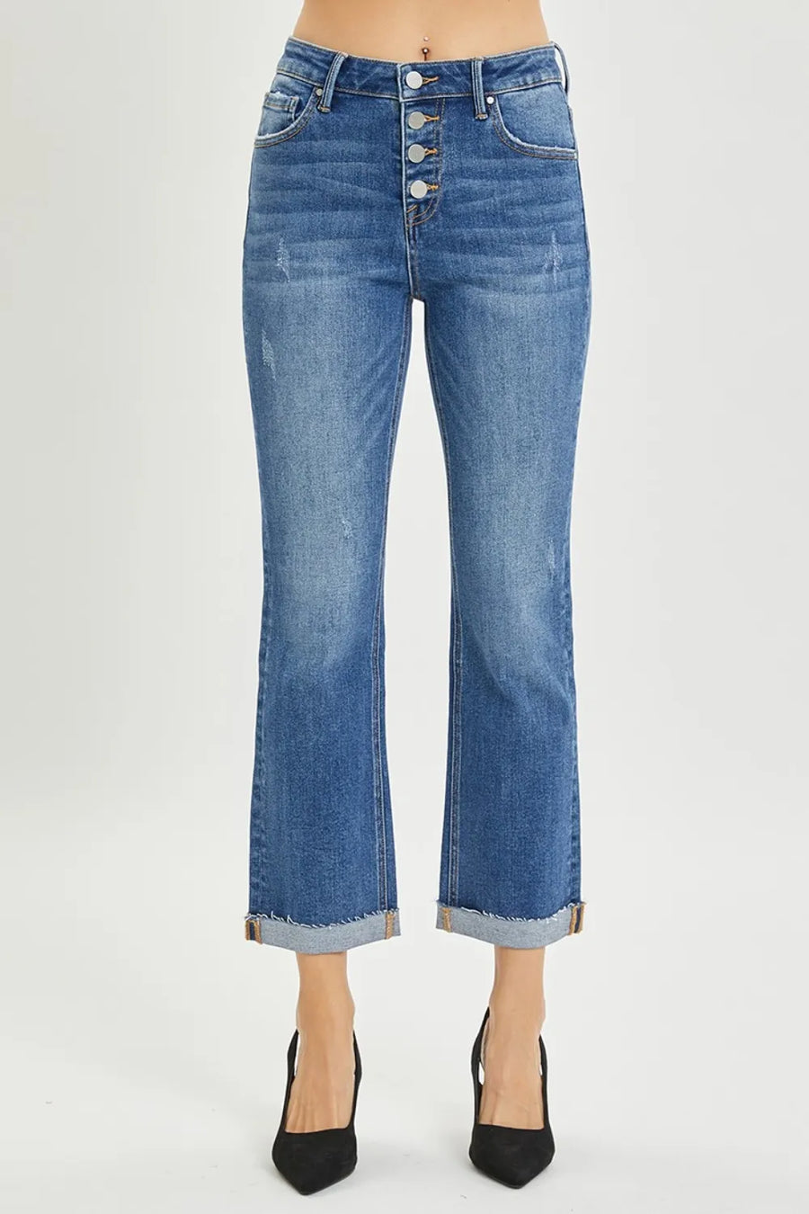 Blue jeans with a button fly on a white background