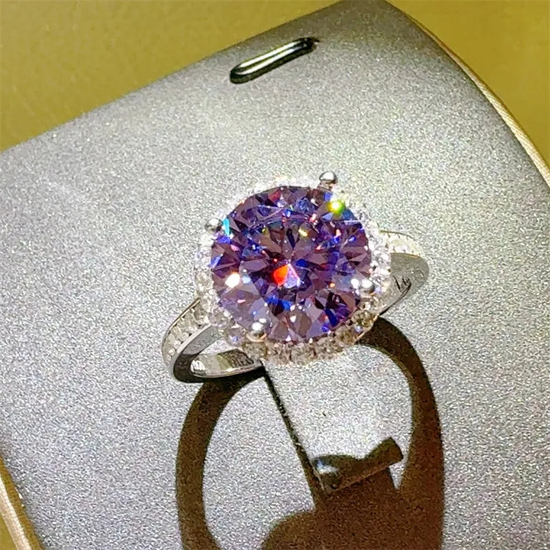 Ring with a purple gemstone on a textured surface