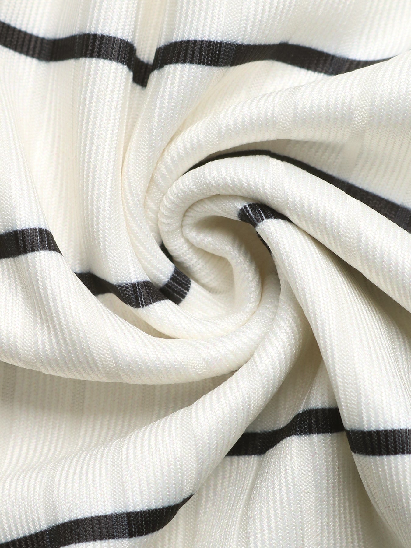 Close-up of white fabric with black stripes