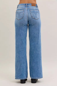 Blue jeans on a beige background