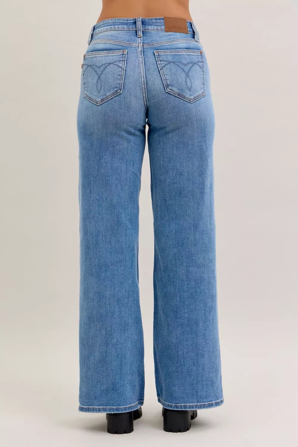 Blue jeans on a beige background