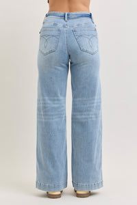 Light blue jeans on a plain background