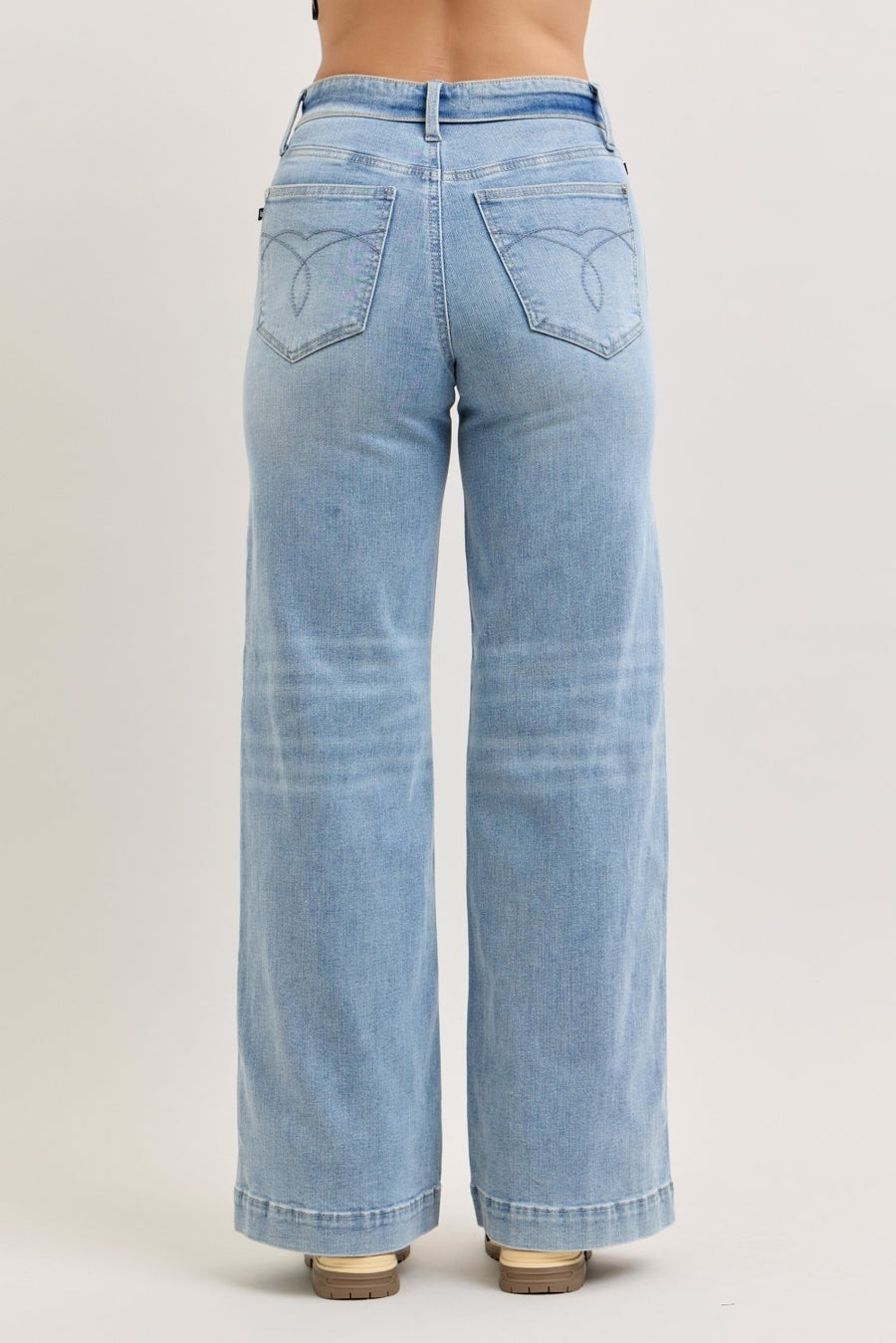 Light blue jeans on a plain background