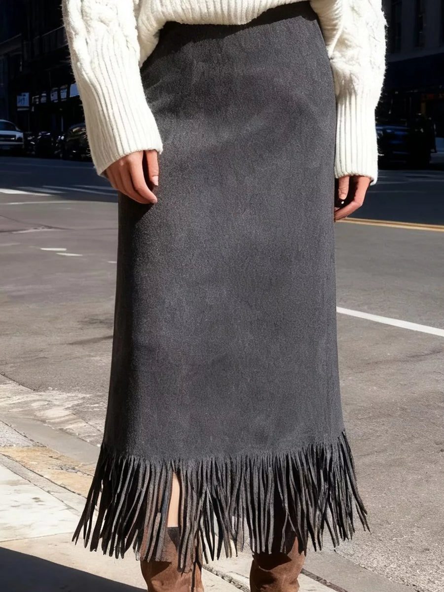 Lady on a sidewalk taking a picture in a gray High-Waisted Fringe Midi Skirt